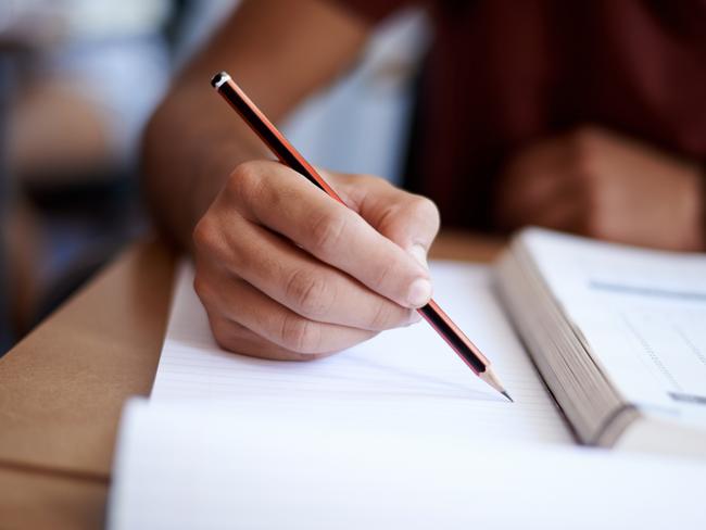 Close up of hands of a student during an exam. Picture: istock