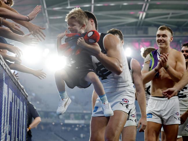 Royal Children’s Hospital patient Ollie, 4, leads the Blues off Marvel Stadium after their win over the Kangaroos. Picture: Michael Klein