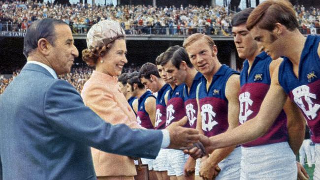 April 5, 1970: Fitzroy president Ern Joseph introduces players to the Queen who is shaking hands with rover John Murphy during half time of their opening round match against Richmond at the MCG. On Murphy's right are Bob Hodgkin and Daryl Herrod.