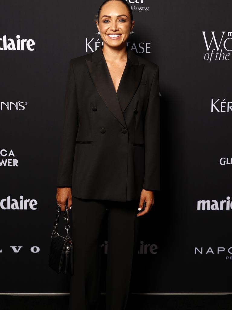 Matildas player Kyah Simon posed for photographers in a chic black suit. Picture from Jonathan Ng.