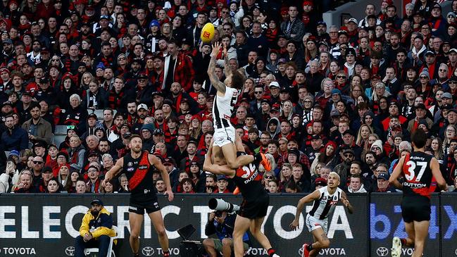 MELBOURNE, AUSTRALIA - APRIL 25: Jamie Elliott of the Magpies takes a spectacular mark over Ben McKay of the Bombers during the 2024 AFL Round 07 match between the Essendon Bombers and the Collingwood Magpies at the Melbourne Cricket Ground on April 25, 2024 in Melbourne, Australia. (Photo by Michael Willson/AFL Photos via Getty Images)