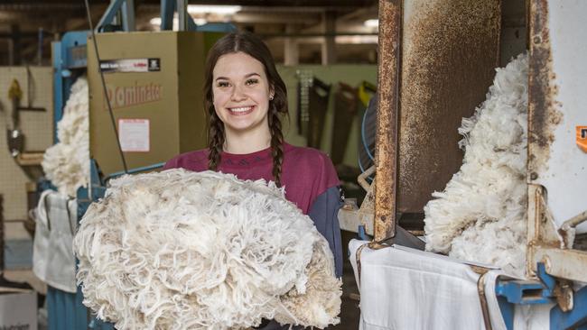 Bridgit Burns from Vancouver, Canada, working in the shearing shed. Picture: Zoe Phillips