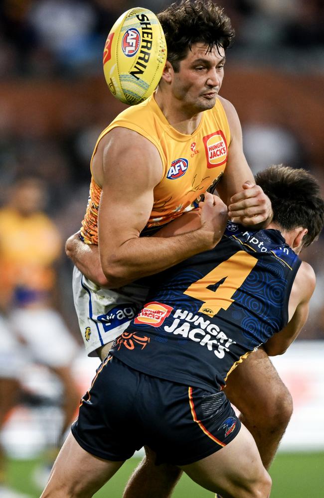 Adelaide’s Lachlan Murphy tackles Tom Barrass. Picture: Mark Brake/Getty Images