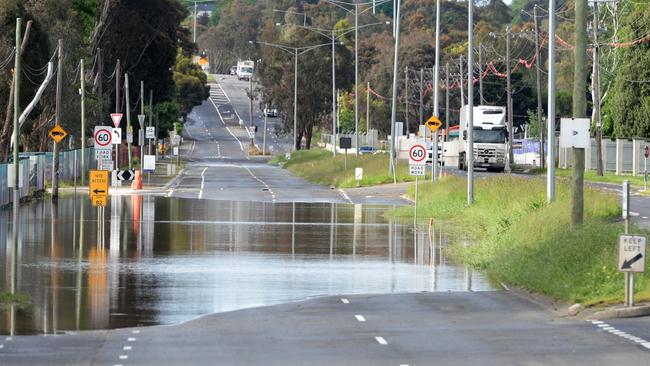 Floodwaters block the south-bound lanes of Bulleen Rd at Bulleen. Picture: Andrew Henshaw