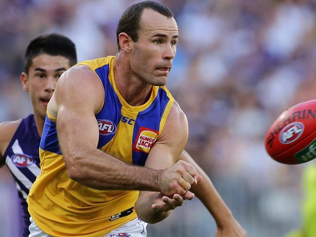 PERTH, WESTERN AUSTRALIA - APRIL 29:  Shannon Hurn of the Eagles handpasses the ball during the Round 6 AFL match between the Fremantle Dockers and West Coast Eagles at Optus Stadium on April 29, 2018 in Perth, Australia.  (Photo by Will Russell/AFL Media/Getty Images)