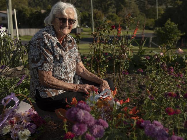 Cobargo local May Blacka is pictured in her flower garden. Picture: Getty