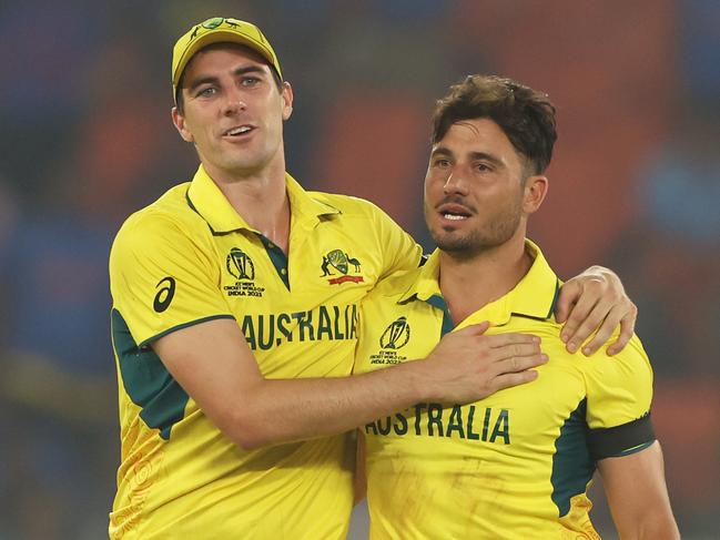 AHMEDABAD, INDIA - NOVEMBER 04: Marcus Stoinis and Pat Cummins of Australia celebrates the wicket of Chris Woakes of England during the ICC Men's Cricket World Cup India 2023 between England and Australia at Narendra Modi Stadium on November 04, 2023 in Ahmedabad, India. (Photo by Robert Cianflone/Getty Images)