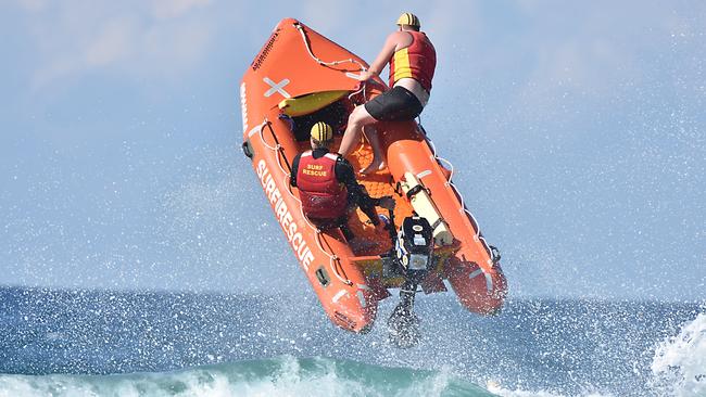 An Alexandra Headland team flies high during the Queensland IRB (inflatable rescue boat) Championships on the Gold Coast.