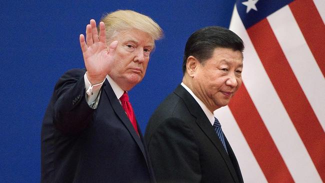 US President Donald Trump (L) and China's President Xi Jinping leaving a business leaders event at the Great Hall of the People in Beijing.