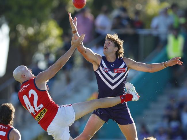 Luke Jackson competes in the air with Demons recruit Aidan Johnson on Sunday. Picture: James Worsfold/AFL Photos/via Getty Images.