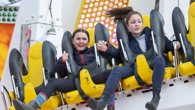 Terrified Tiana and Ava hold hands on the Space Roller – but had the ride stopped early, it was just too terrifying. Picture Mark Brake