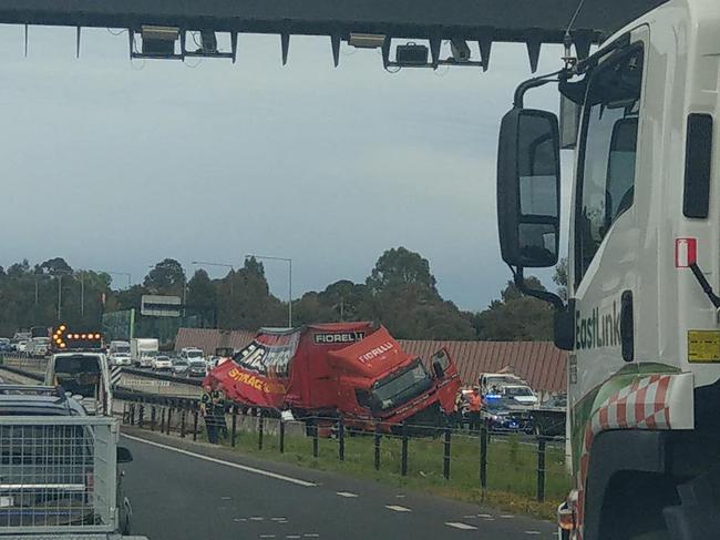 Emergency services are working to clear a crash on EastLink in Rowville. Credit: John Anderson