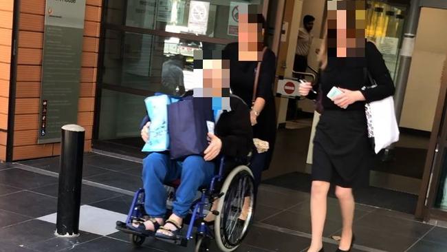 A 68-year-old Blacktown man leaves Blacktown Local Court with his carers after being sentenced on child abuse material charges.