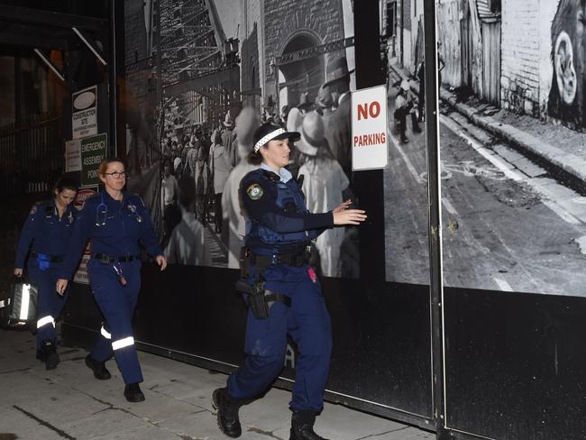 Police and paramedics race to the scene. Picture: Gordon McComiskie