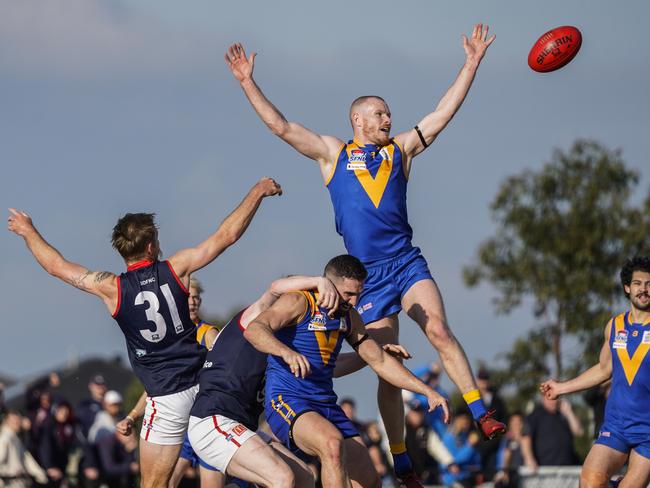 Mitch White soars high for the Cranbourne Eagles on Saturday. Picture: Valeriu Campan