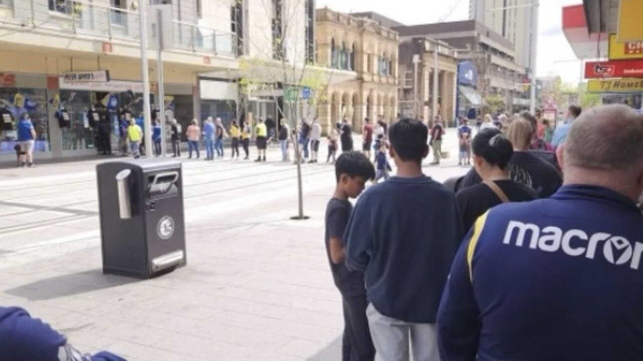 Faithful fans line up for merchandise outside the Peter Wynn store. Picture: Supplied;