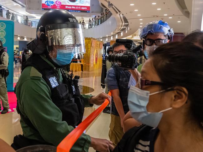 Riot police stand guard during a clearance operation during a demonstration in a mall this week in Hong Kong, China. Picture: AFP