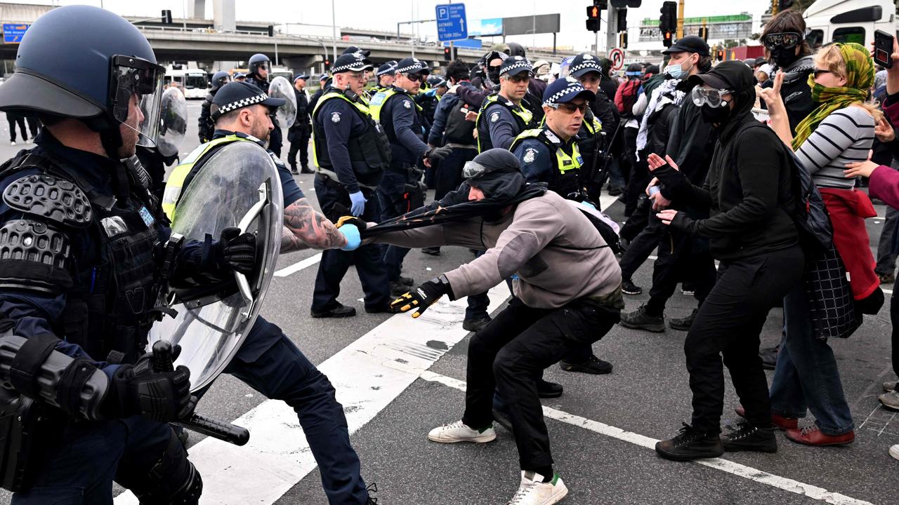 Protesters clash with police outside the Land Forces 2024 expo in Melbourne. Picture: William West/AFP