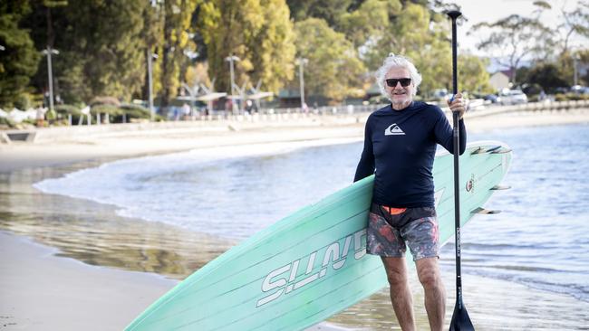 Steven Last felt like he was dancing on water after paddle boarding in perfect weather conditions at Long Beach, Sandy Bay. Picture: Chris Kidd