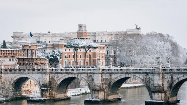 Stroll along the twisting River Tiber for a unique view of the city.