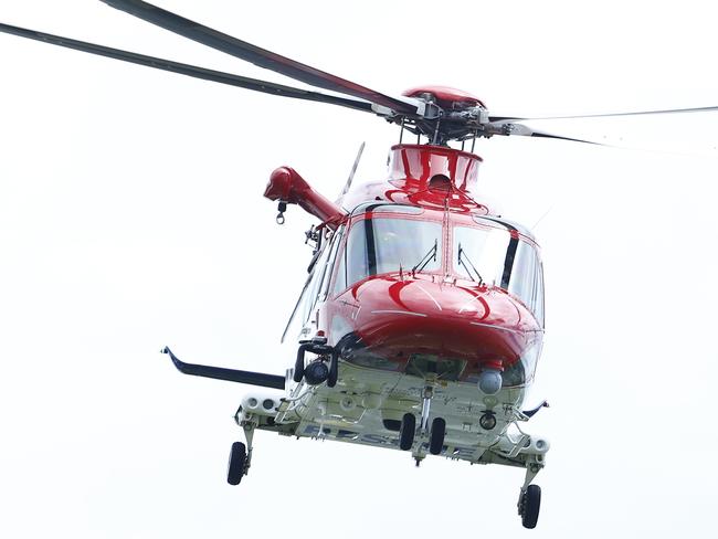 QG Air Rescue 510 emergency services helicopter arrives at the Cairns Hospital helipad after delivering the patient in a serious condition. Picture: Brendan Radke