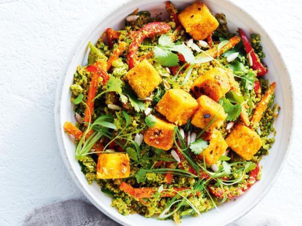 Broccoli rice with spiced chilli tofu and sunflower seeds.