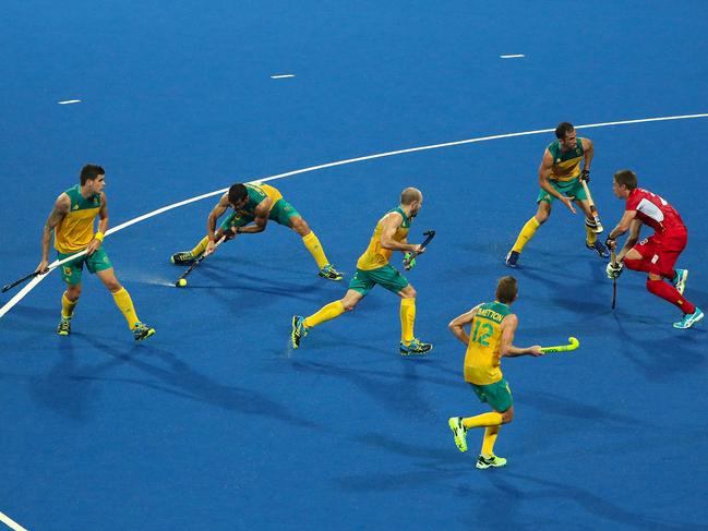 RIO DE JANEIRO, BRAZIL - AUGUST 09: Chris Ciriello #5 of Australia shoots the ball against Jerome Truyens #28 of Belgium during the hockey game on Day 4 of the Rio 2016 Olympic Games at the Olympic Hockey Centre on August 9, 2016 in Rio de Janeiro, Brazil. (Photo by Christian Petersen/Getty Images)