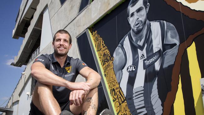 Hawthorn skipper Ben Stratton sits beside a mural of himself at Waverly. Picture: Michael Klein