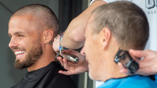 Craig Bellamy and Sandor Earl having a laugh during the shave. Picture Jay Town