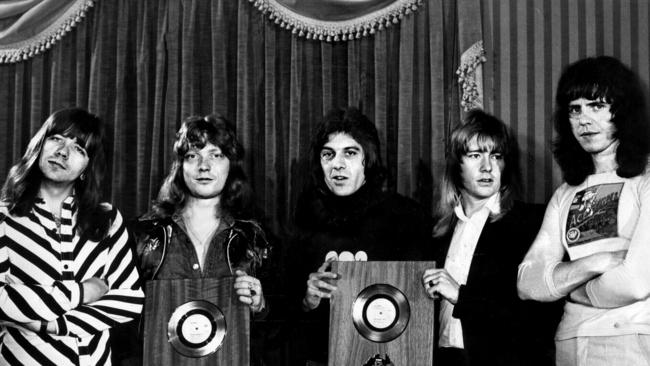 Ian "Molly" Meldrum (centre) presented The Sweet with their gold records in the 1970s. The glam rockers were still performing in 1990 and Frankston was part of the British band’s Australian tour. Picture: TV Week.