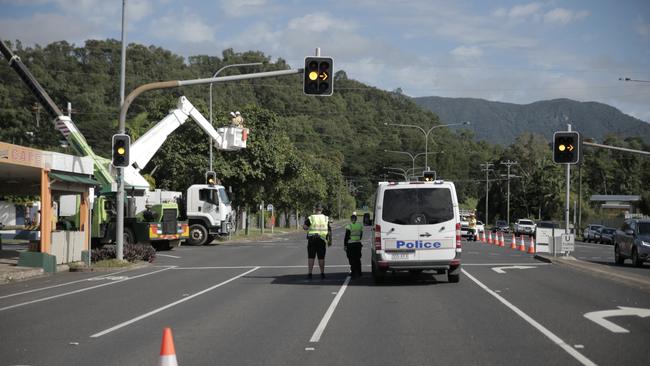 Ergon Energy crew conduct repairs on power lines following a two-vehicle collision at the intersection of Enmore St and Reservoir Rd, Manoora with a sedan careering into a power pole, about 12am, July 3, 2021. Picture: Arun Singh Mann