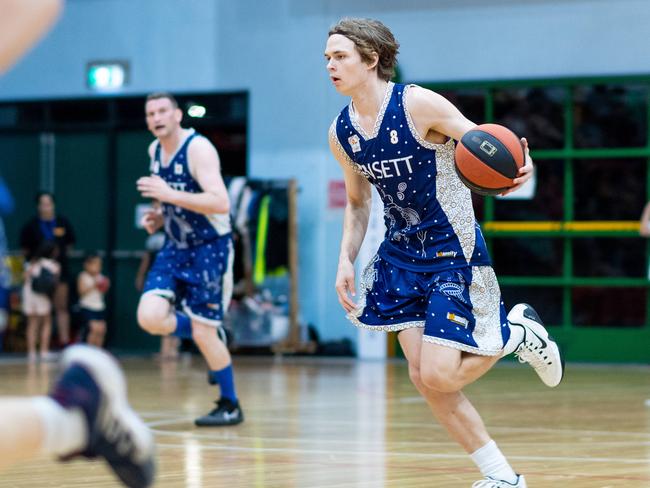 Joel De Barros dribbles the ball in Darwin Basketball Men's Championship Round 20: Ansett v Tracy Village Jets. Picture: Che Chorley