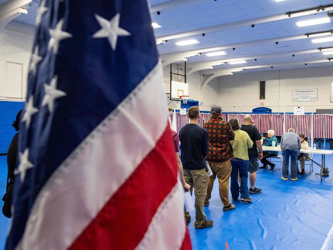 People wait in line to vote at the Green Street Community Center in Concord, New Hampshire, on November 5, 2024. (Photo by Joseph Prezioso / AFP)