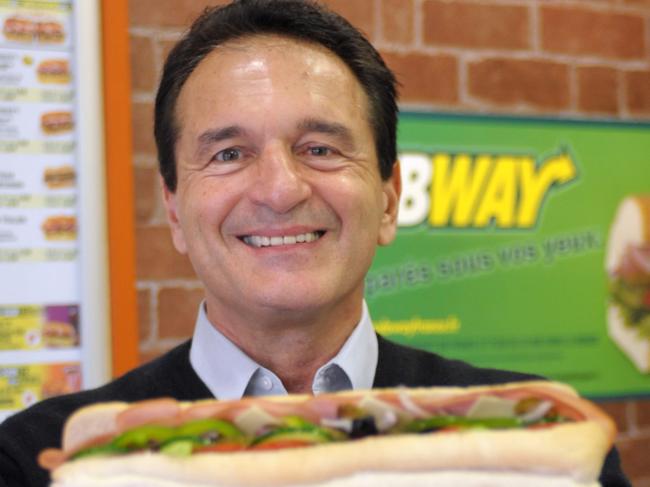 (FILES) In this June 17, 2011 file photo,US sandwich maker Subway co-founder Fred DeLuca, poses with a sandwich in a Parisian Subway restaurant on the 10th anniversary of Subway France. Fred DeLuca, who parlayed a $1,000 loan from a friend into the global Subway sandwich chain, has died at 67 of leukemia, the company announced Tuesday on its website. DeLuca had been treated for the disease since 2013 and had named his sister, Suzanne Greco, as president to run day-to-day operations. His death comes just weeks after Subway celebrated the company's 50th anniversary, the company said in a statement that described co-founder DeLuca as a 