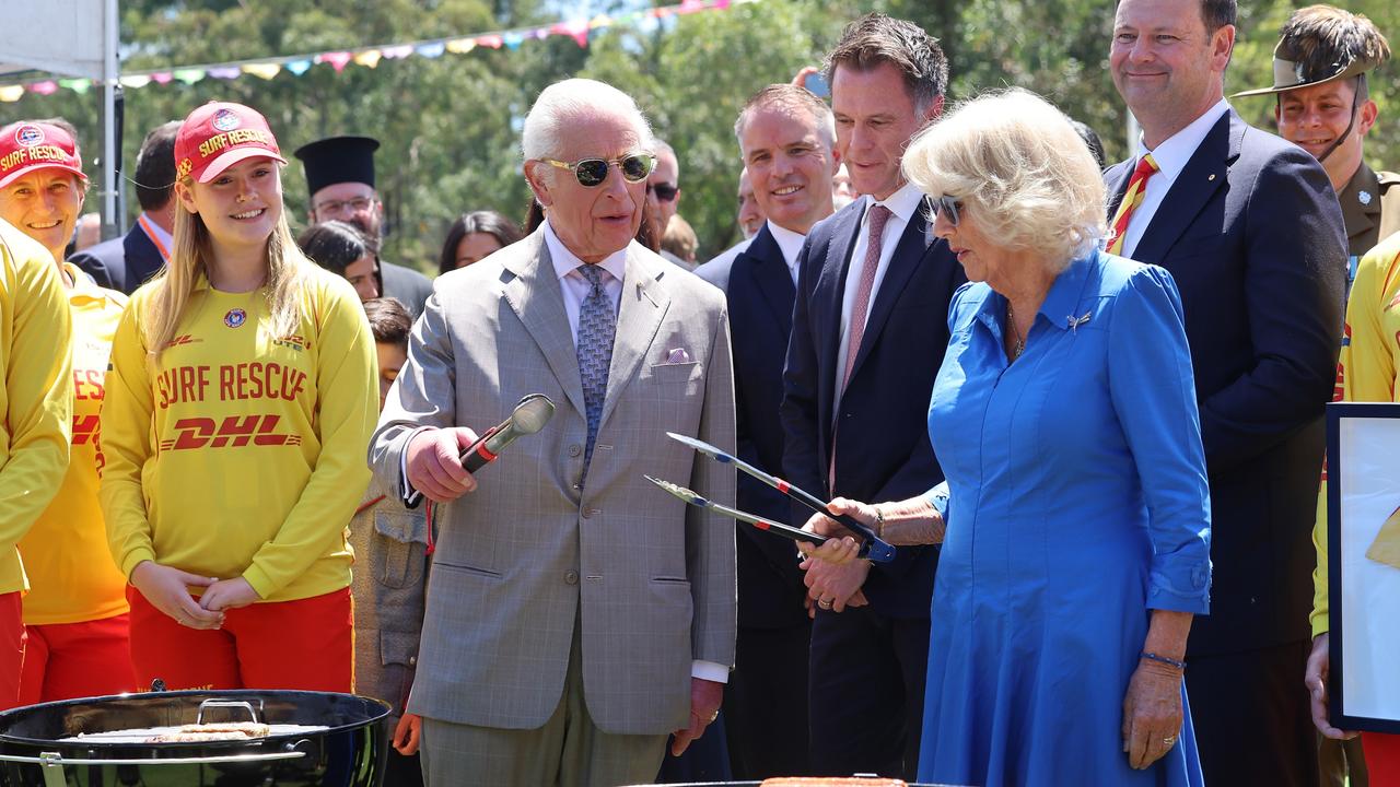 The King and Queen raise their tongs. Picture: Chris Jackson/Getty Images