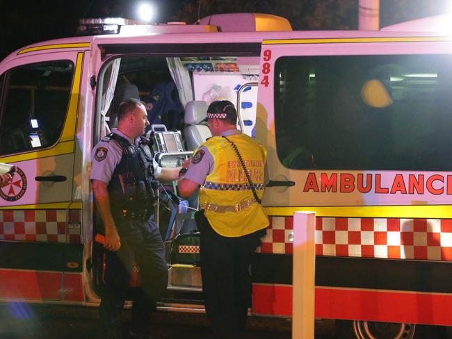 Generic Ambulance images. NSW Ambulance vehicles and Paramedics. Ambulance officers attend the scene of a crash at Qantas Drive, Mascot. Pics Bill Hearne