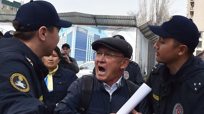 Police detain a participant in an anti-war rally in Gorky Park, in Bishkek. Picture: AFP