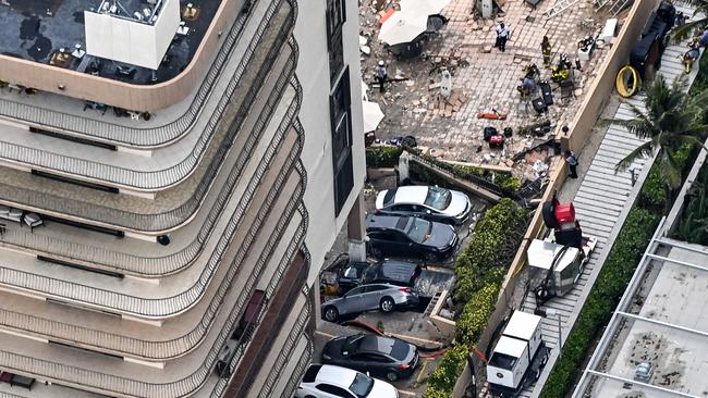 This aerial view, shows search and rescue personnel working on site after the partial collapse of the Champlain Towers South in Surfside, north of Miami Beach.