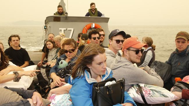 Evacuees ship out of Mallacoota after being trapped for days. Picture: David Caird