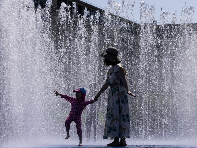 Kids cool themselves in a fountain outside the Queen Elizabeth Hall on the Southbank. Picture: Getty Images