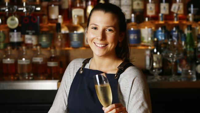 Emily Gardam of Hobart is pictured serving a champagne at 'The Den', Salamanca, Hobart.  PICTURE: MATT THOMPSON