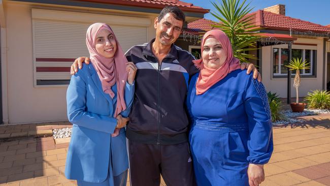 Melina Al Shahoud with her parents Ragheb and Thanaa Al Shahoud outside their Salisbury home. Picture: Ben Clark