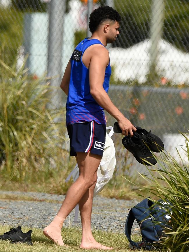 Jason Johannisen leaves the training track after being hurt.