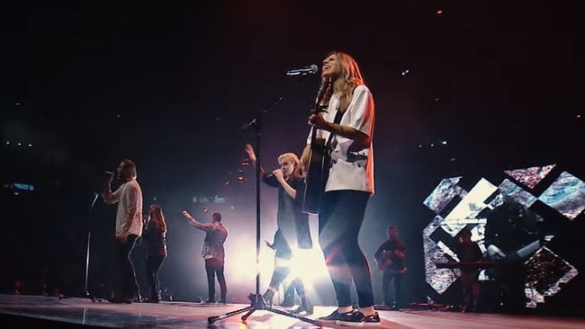 Hillsong Worship performing <i>What A Beautiful Name.</i>