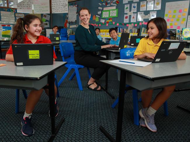 Stephanie Gulesserian, teacher Miss Camilla Brown and Iris Gregory at an online meeting with students from home at Our Lady of Dolours School in Chatswood. Picture: Justin Lloyd