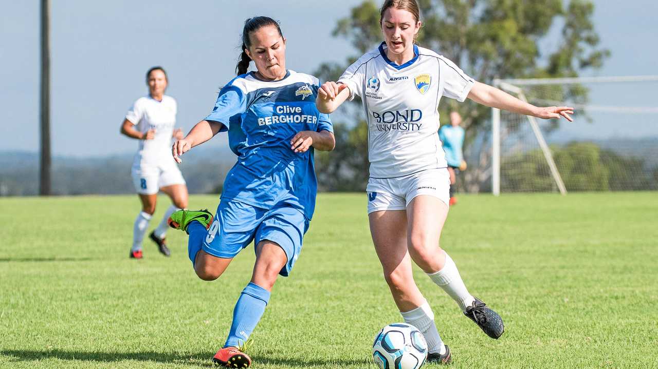 ON THE BALL: South West Queensland Thunder player Jess Fry (left) battles her Gold Coast opponent for possession of the ball. Picture: DSL Photography