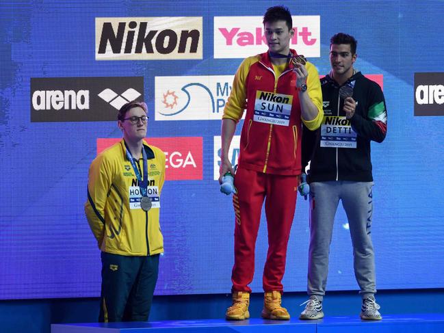 (FILES) In this file photo taken on July 21, 2019 silver medallist Australia's Mack Horton (L) refuses to stand on the podium with gold medallist China's Sun Yang (C) and bronze medallist Italy's Gabriele Detti after the final of the men's 400m freestyle event during the swimming competition at the 2019 World Championships at Nambu University Municipal Aquatics Center in Gwangju. - Horton says he would have carried out his controversial podium protest against China's Sun Yang even if he had known fellow Australian swimmer Shayna Jack failed a drugs test. (Photo by Ed JONES / AFP)