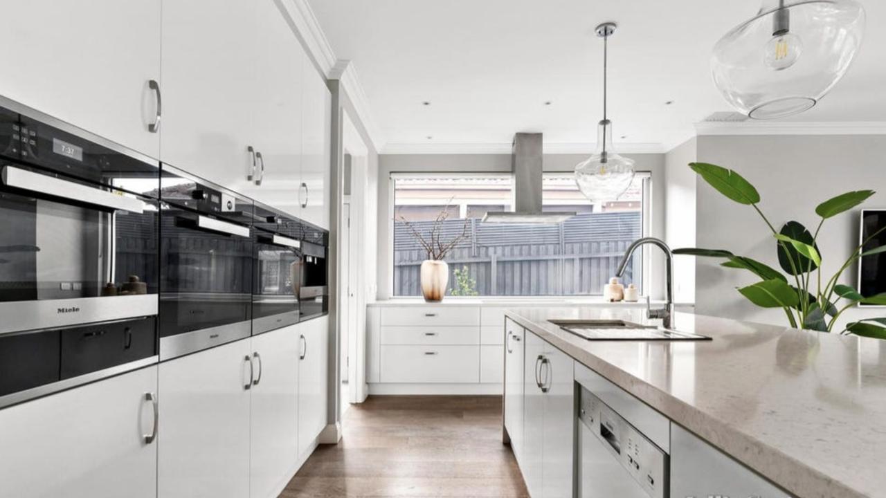 A chef’s dream kitchen with premium Miele appliances and butler’s pantry.