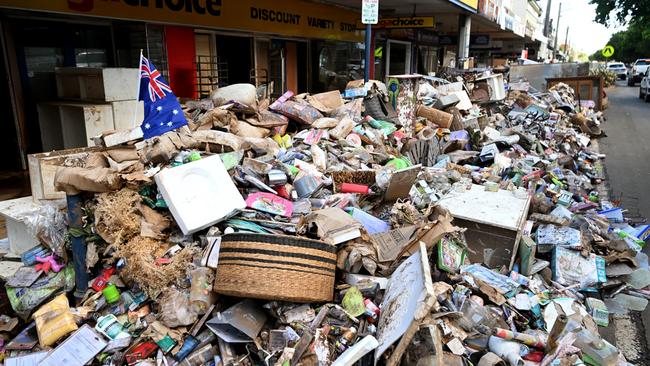 Piles of flood-damaged goods line a main street in central Lismore on March 04. Photo: Dan Peled/Getty Images