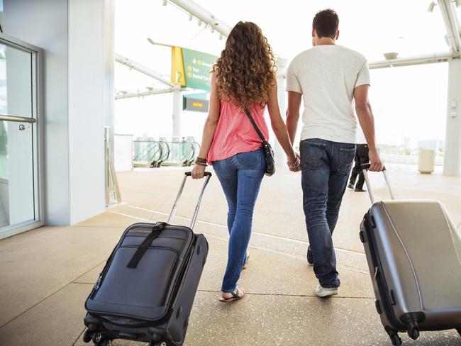 DRIP PRICING  ..  photo of a couple with bags at an airport